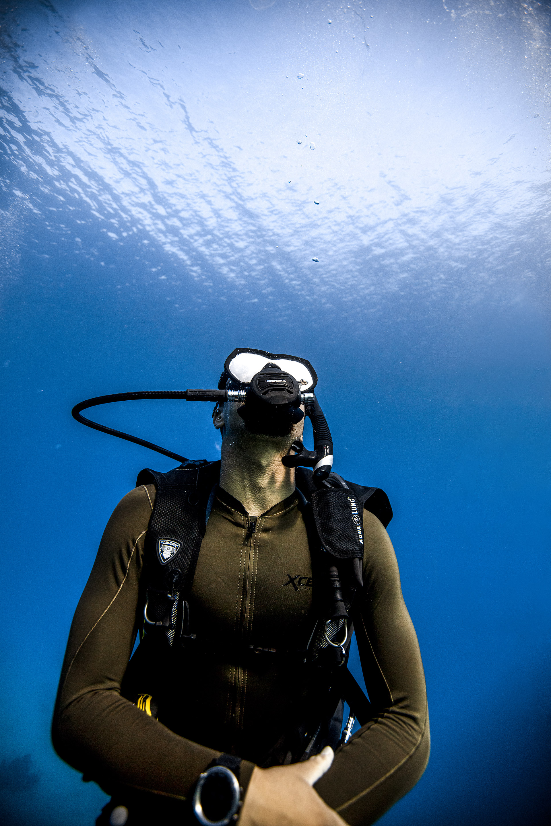 Scuba diver underwater with full diving gear