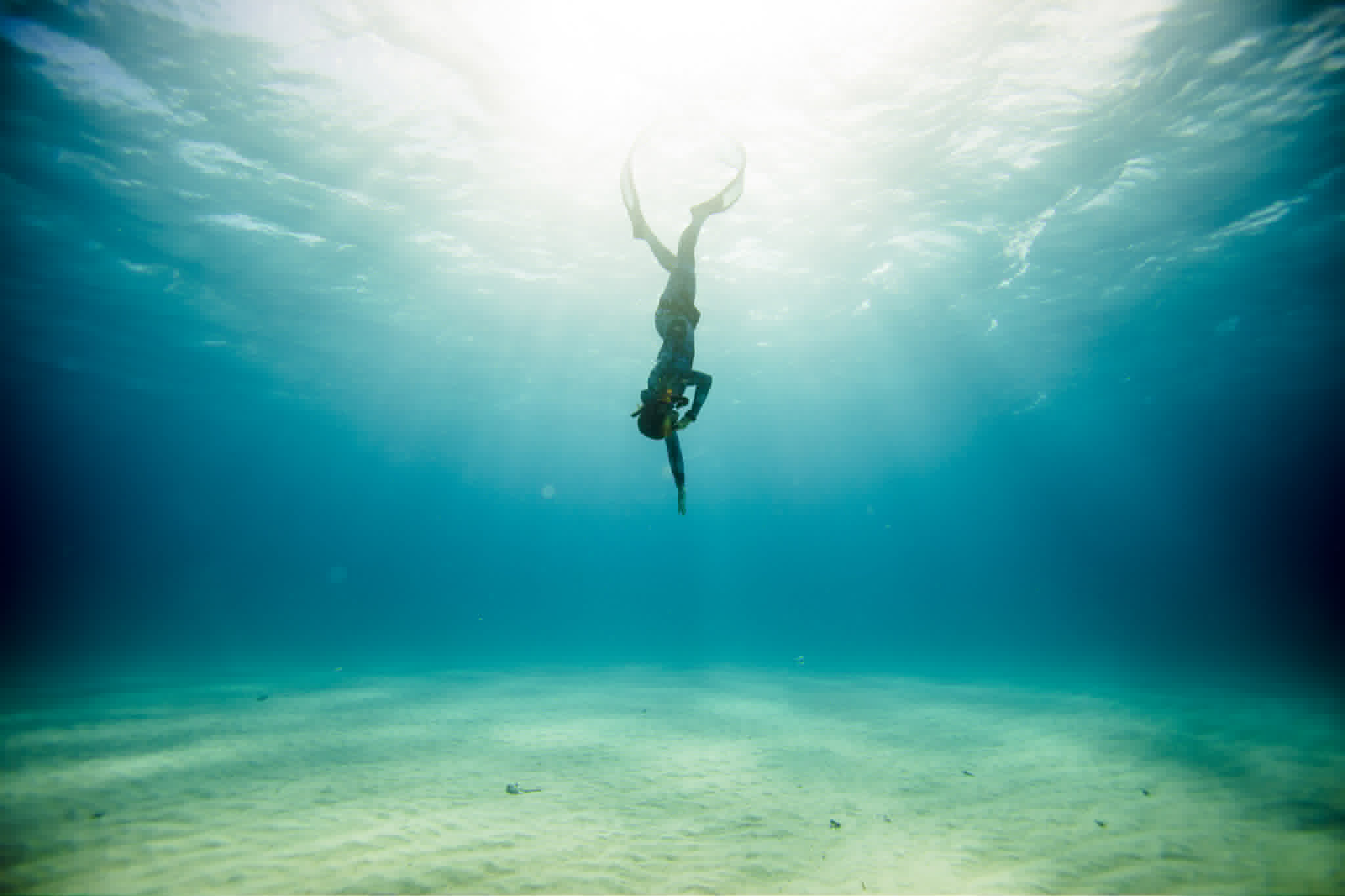 Snorkeler diving in crystal clear waters around Ammouliani Island in Halkidiki Greece